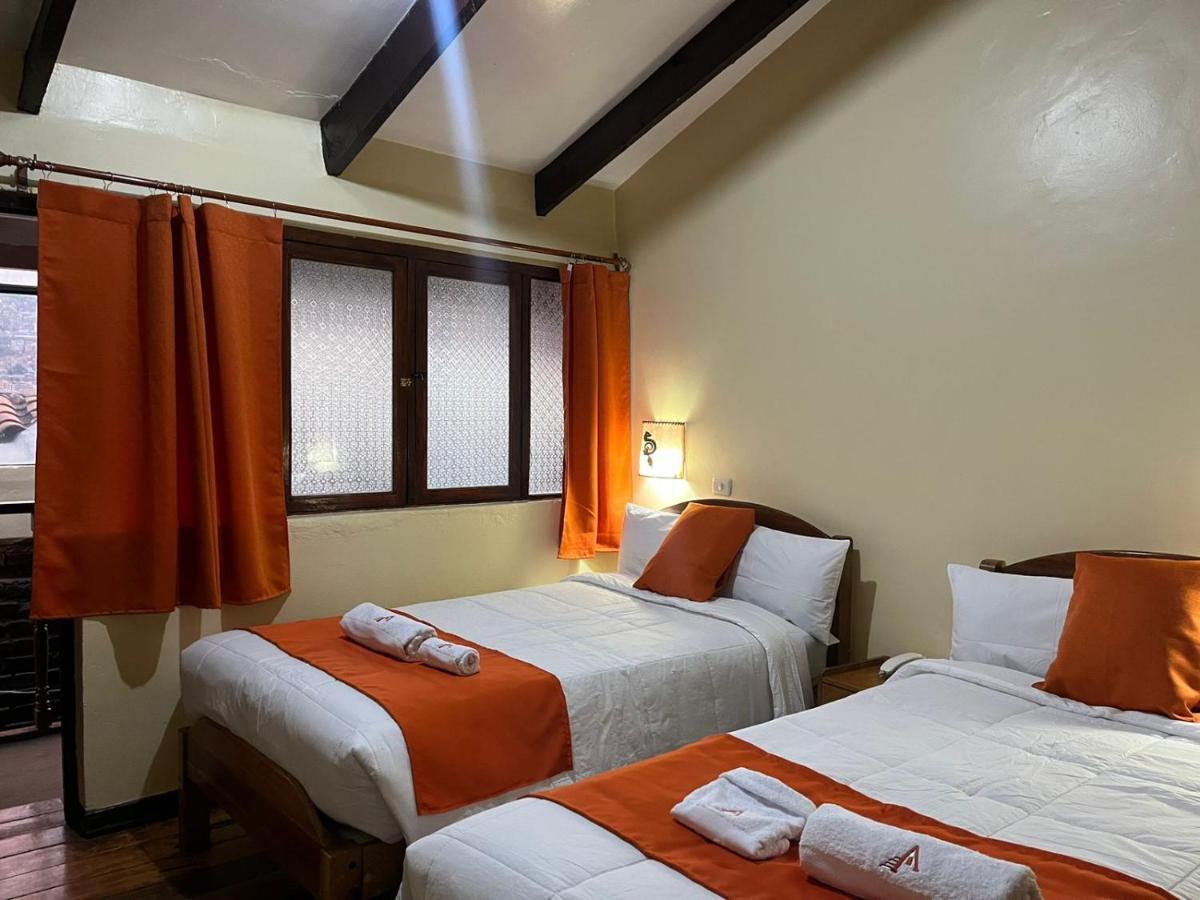 ホテル Hostal Andenes De Alabado クスコ エクステリア 写真