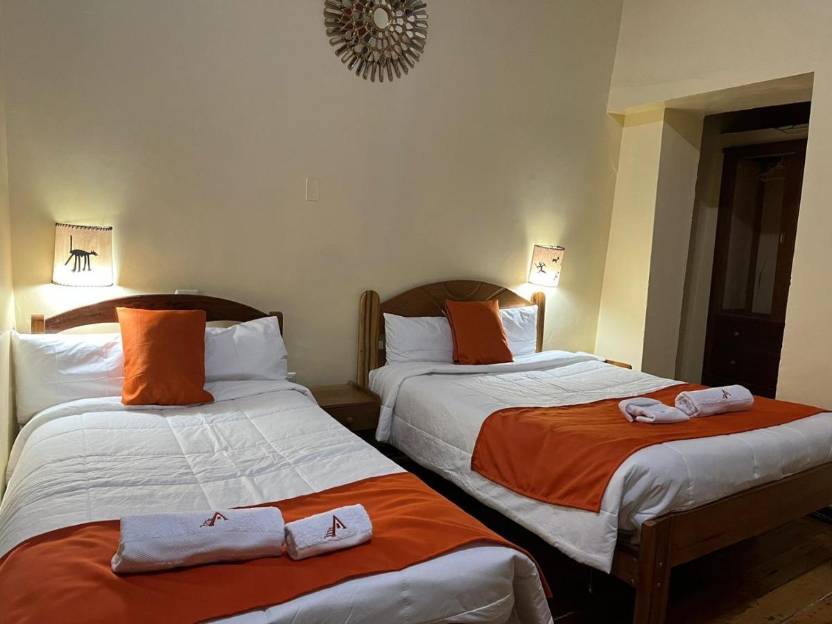 ホテル Hostal Andenes De Alabado クスコ エクステリア 写真